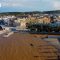 Maltempo a Otranto, la spiaggia si “tinge” di rosso